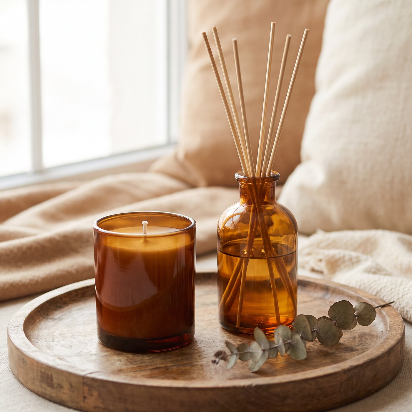 Amber glass candle and reed diffuser styled together