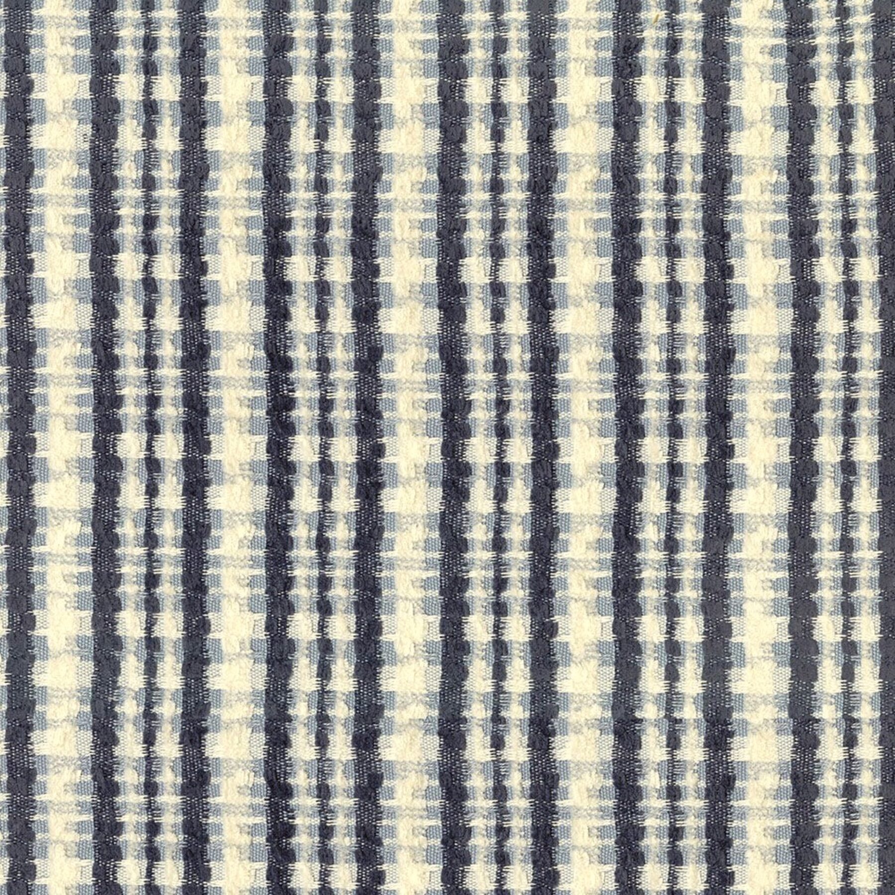 Macro detail of the Jackie linen blend fabric, a navy and cream plaid